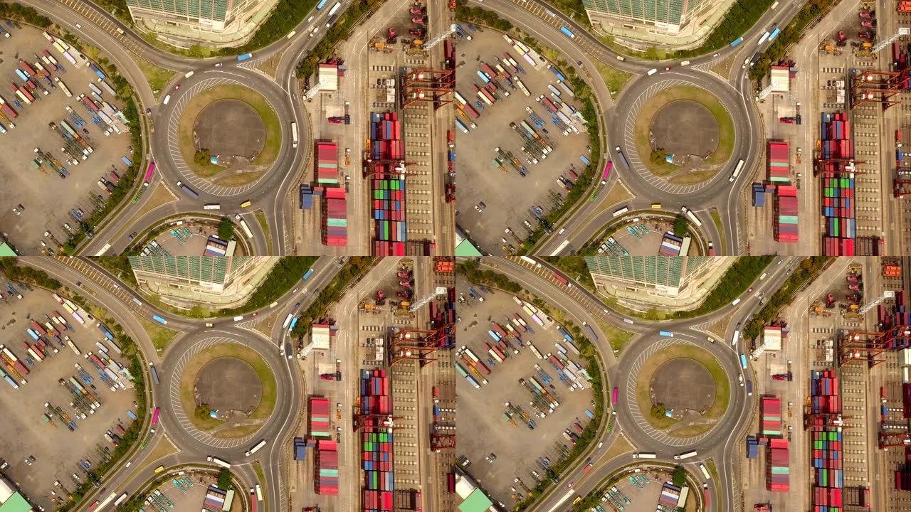 带有环形交叉路口和集装箱的高速公路路口的鸟瞰图。物流运输概念中的桥梁道路形圈结构。顶视图。中国香港中